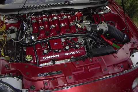 1997 Ford Taurus - The engine bay shows a Yamaha 3.4L V6 engine, not a 1997 Ford Taurus.