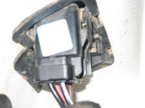 2001 Jeep Wrangler - An electrical connector with multiple wires is visible, attached to a dark plastic component.