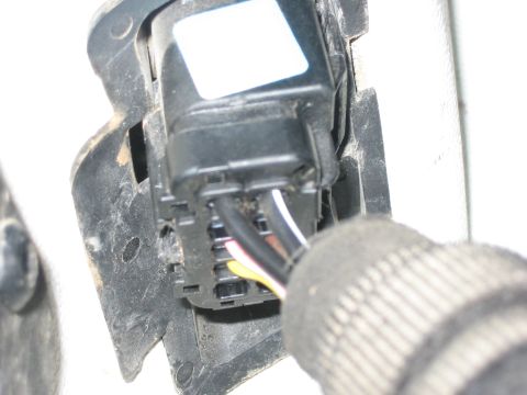 2001 Jeep Wrangler - A close-up view of an electrical connector with a white label and multiple wires, likely a vehicle part.