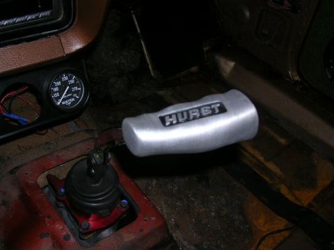 1975 Ford Ranchero - Interior view showing a Hurst shifter and a water temperature gauge.