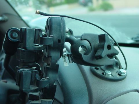 1994 Ford Bronco - Close-up of a dashboard mount holding an antenna, with a visible Garmin label.