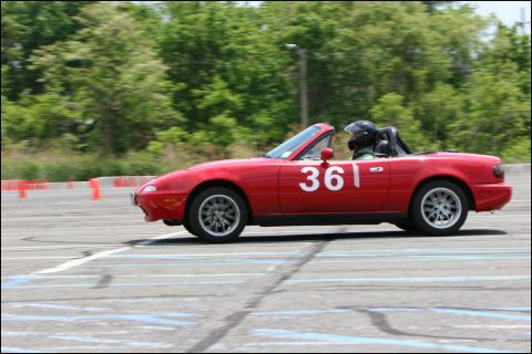 2001 Mercury Grand Marquis - A red convertible with racing number 361 navigates a course marked by orange cones.