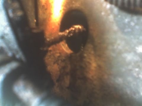 1991 Ford Bronco - A detailed view of a corroded metal component, possibly from a vehicle's braking system.