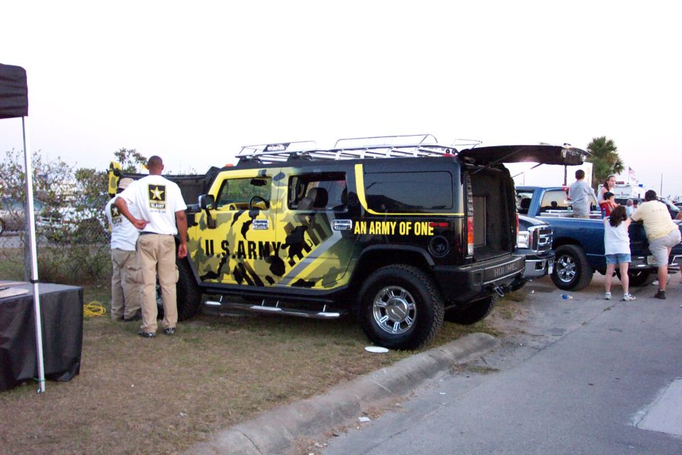 Black and yellow camouflage Hummer H2 with U.S. Army livery and "AN ARMY OF ONE" text