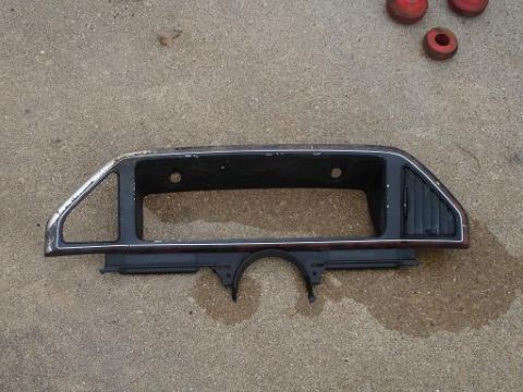 1996 Ford F-150 - A dashboard trim piece with a vent is shown on a concrete surface.