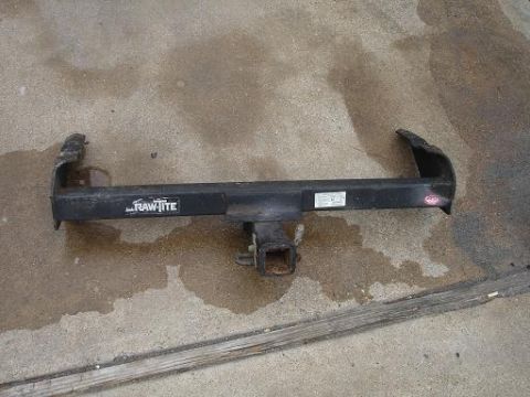 1996 Ford F-150 - A trailer hitch is shown on a concrete surface, with a 'RAW-TITE' logo visible.