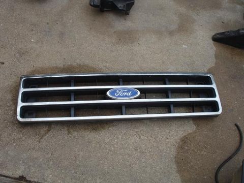 1996 Ford F-150 - The grille from a 1996 Ford F-150 is shown, identified by its distinct design and emblem.