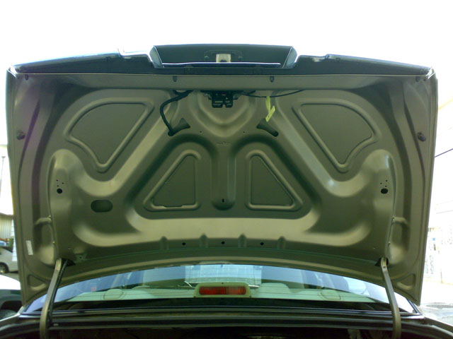 Trunk interior of a 2007 Mercury Grand Marquis, beige metallic paint