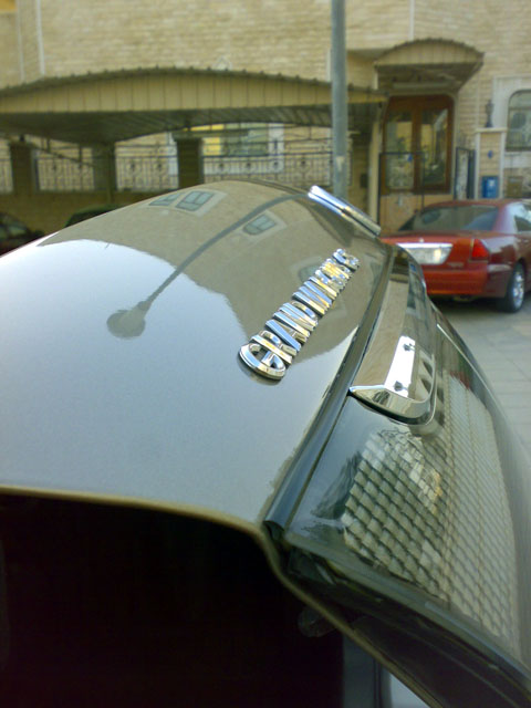 2007 Mercury Grand Marquis - The chrome lettering on the trunk lid clearly identifies this vehicle as a Grand Marquis, matching the registry's claim.