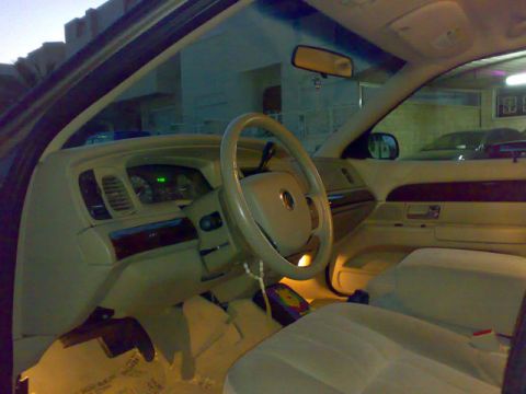 2007 Mercury Grand Marquis - Interior view of a 2007 Mercury Grand Marquis, highlighting the dashboard and seating.