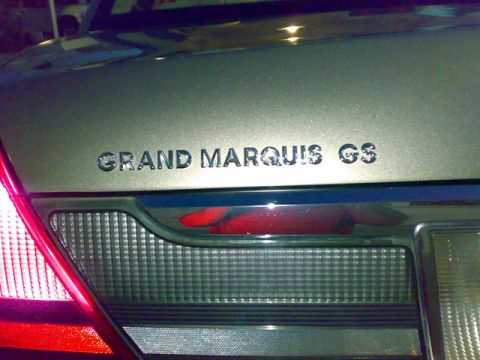 2007 Mercury Grand Marquis - Rear view of a 2003 Mercury Grand Marquis, showing the GS emblem and taillight detail.