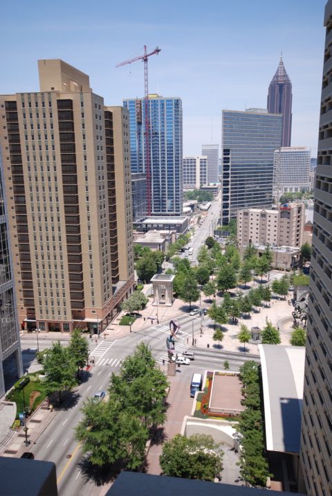 1996 Ford Bronco - Aerial view of a city street with urban architecture and green spaces.