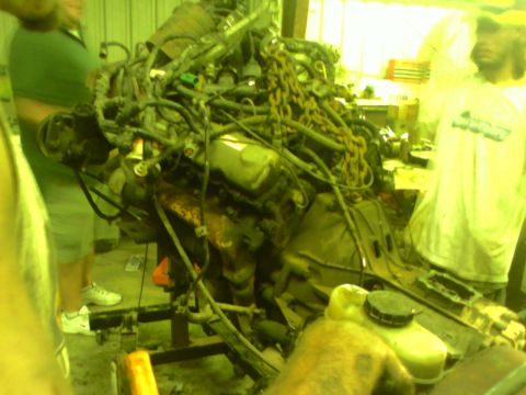 1982 Ford Bronco - This complex engine assembly is being worked on in a garage setting.