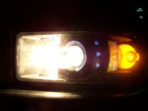 2001 Dodge 1500 - Close-up of a vehicle's headlight assembly, showing the low beam, projector, and turn signal.