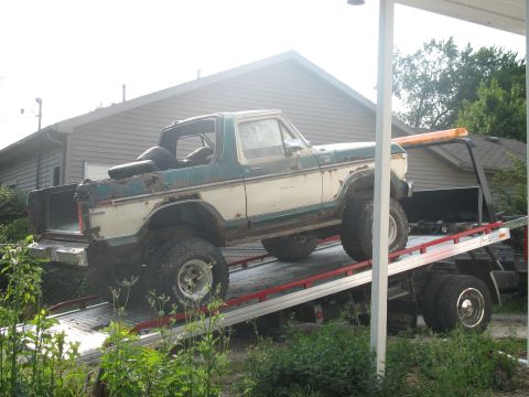 1978 Ford Bronco - This 1978 Ford Bronco is being loaded onto a tow truck, showing its lifted suspension and two-tone paint.