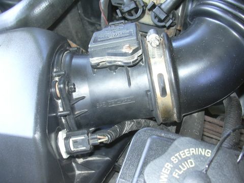 1996 Ford Crown Victoria - Mass air flow sensor and intake tube assembly, part of a vehicle's air intake system.
