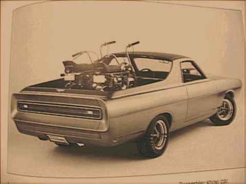 1967 Ford Ranchero - Rear view of a 1967 Ford Ranchero pickup truck carrying two motorcycles in its bed.