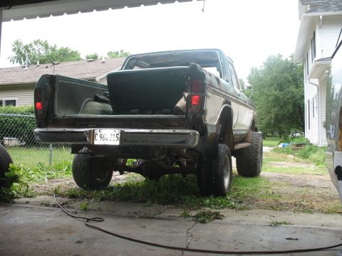 1978 Ford Bronco - This 1978 Ford Bronco is parked in a driveway with its tailgate open, revealing the interior cargo space.
