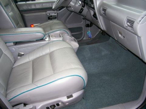 1994 Ford Explorer - Interior view of a 1994 Ford Explorer, showing the front seats, dashboard, and center console.