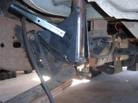 1995 Ford Bronco - This photo shows a custom suspension modification with visible text on a metal plate.