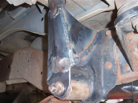1995 Ford Bronco - Close-up view of a welded suspension component, with the Supermotors.net logo visible in the lower right corner.