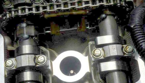 1997 Ford Taurus - Close-up view of engine camshafts and timing chain mechanism.