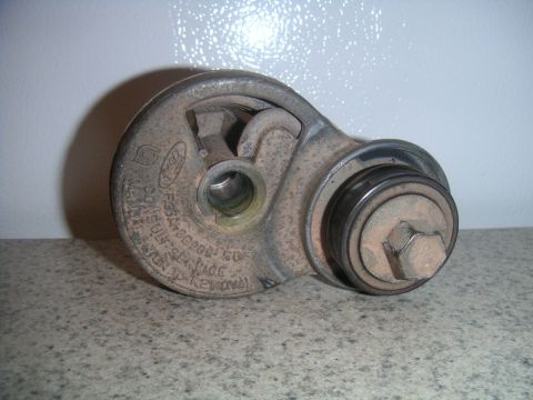 1994 Ford Bronco - A Ford alternator pulley tensioner is shown, with visible text indicating part number F50A-6026-GO.