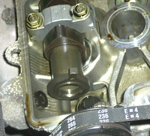 1997 Ford Taurus - A close-up view of an engine's internal components, including a camshaft and a timing belt with visible part numbers.