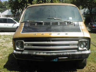 1978 Ford E250 - Front view of a gold Dodge van, showing its grille and headlights. The album claims it is a 1978 Ford E250.