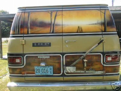 1978 Ford E250 - This 1978 Ford E250 van features a custom mural on the rear doors and wood grain paneling on the lower body.