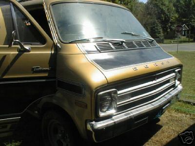 1978 Ford E250 - This van has a two-tone paint scheme and a prominent Dodge grille.