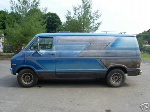 1978 Ford E250 - This van has a distinctive custom paint job with blue and silver accents along its side.