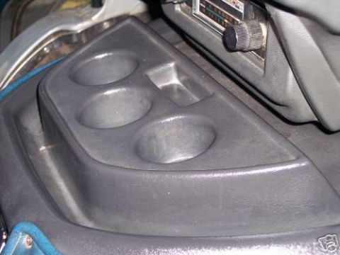 1978 Ford E250 - Close-up of the interior showing a cup holder and radio controls.