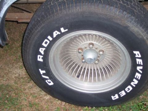 1978 Ford E250 - A close-up view of a tire and wheel assembly, showing white lettering on the tire.