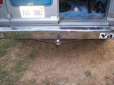 1978 Ford E250 - The rear of a van is shown, including the license plate and a trailer hitch assembly.