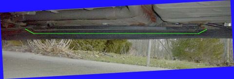 1997 Ford Taurus - Underbody shot along the right-side rocker of a unibody car showing a bolt-on subframe connector, with a green highlight line drawn over th…