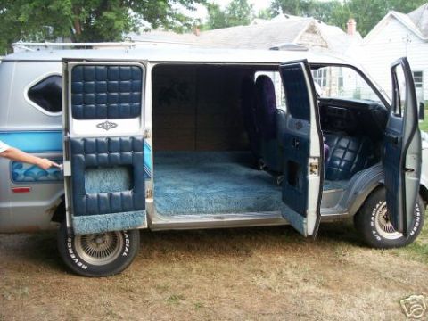 1978 Ford E250 - This 1978 Ford E250 van features a custom interior with plush blue carpeting and quilted blue upholstery on the seats and door panels.