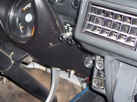 1978 Ford E250 - Close-up of the dashboard showing the fuel gauge, air conditioning vents, and control switches.