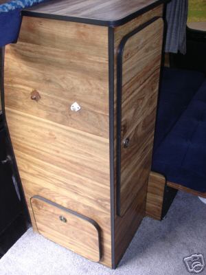 1978 Ford E250 - Custom wooden cabinet installed inside a van, a drawer and two cabinet doors.