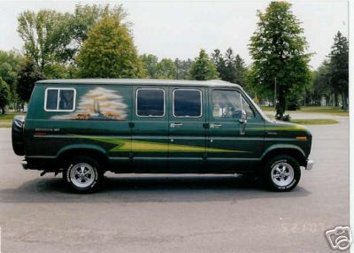 1978 Ford E250 - Driver-side profile of a dark green extended-body Ford Econoline conversion van with an airbrushed outdoor mural of trees and mountains on…