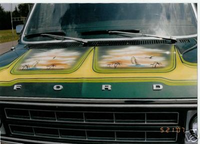 1978 Ford E250 - This van features custom airbrushed beach scenes on its hood, with the Ford logo prominently displayed on the grille.