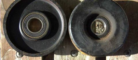 1997 Ford Taurus - Two idler pulleys are shown, one with visible bearing markings. The registry claims this is for a 1997 Ford Taurus, but the image only show…