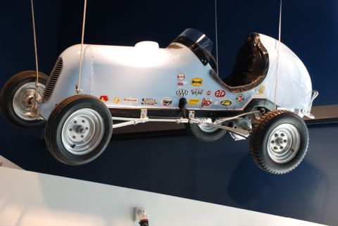 1996 Ford Bronco - This vintage race car is suspended and adorned with numerous sponsor decals.