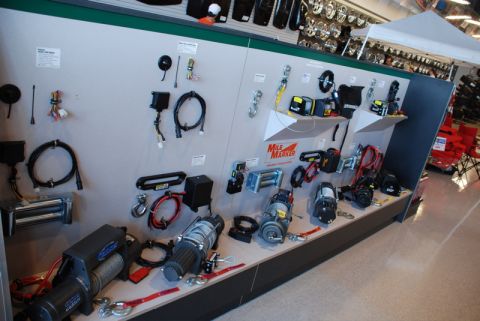 1996 Ford Bronco - Retail display of winches and off-road recovery gear, including Mile Marker products.