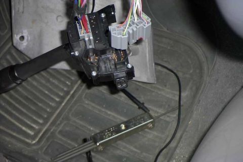 1997 Ford Taurus - Wiring harness for a car's wiper switch is visible on the floor mat.