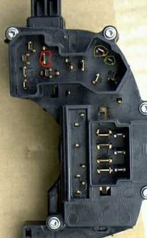 1997 Ford Taurus - Close-up of an automotive electrical component with visible connectors and marked pins.