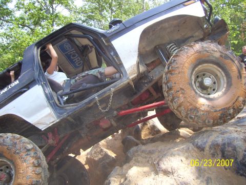 1978 Ford Bronco - This modified Ford Bronco is navigating a challenging rocky terrain.