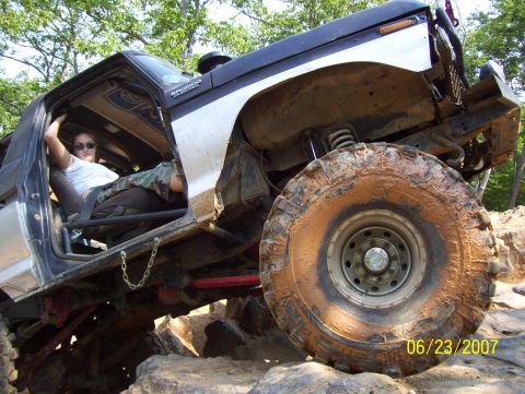 1978 Ford Bronco - A 1978 Ford Bronco navigates a rocky, off-road course with a person in the driver's seat.