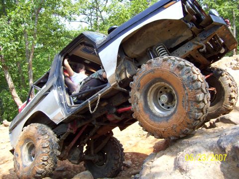 1978 Ford Bronco - Modified 1978 Ford Bronco navigating a rocky trail during an off-road excursion.