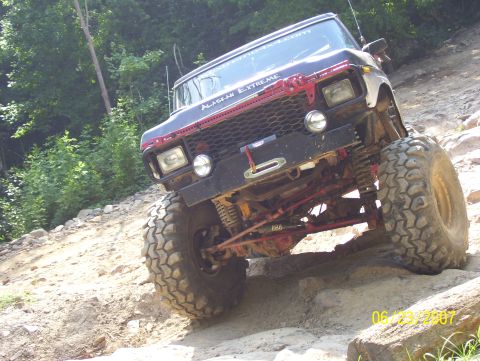 1978 Ford Bronco - This modified off-road vehicle navigates a rocky trail.